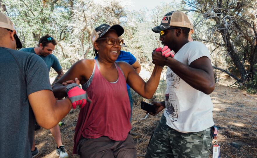 Navy veteran Samantha Scully completes a team building exercise during a trip with the non-profit Higher Ground in Big Bear, Cal. in this undated photo.