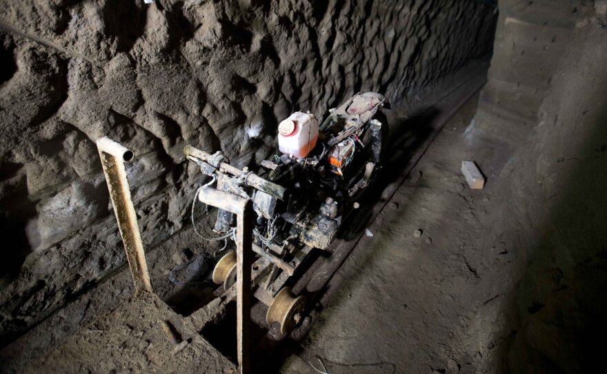 A motorcycle adapted to a rail sits in the tunnel under the half-built house where according to authorities, drug lord Joaquín "El Chapo" Guzmán made his escape from the Altiplano maximum security prison.
