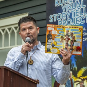 Ethan Banegas reads from the comic book at an event on June 13, 2025 to celebrate the opening of the exhibit at La Jolla Historical Society.