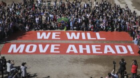 Participants at the COP22 climate conference stage a public show of support for climate negotiations and Paris agreement, on the last day of the conference, in Marrakech, Morocco, Nov. 18, 2016. 