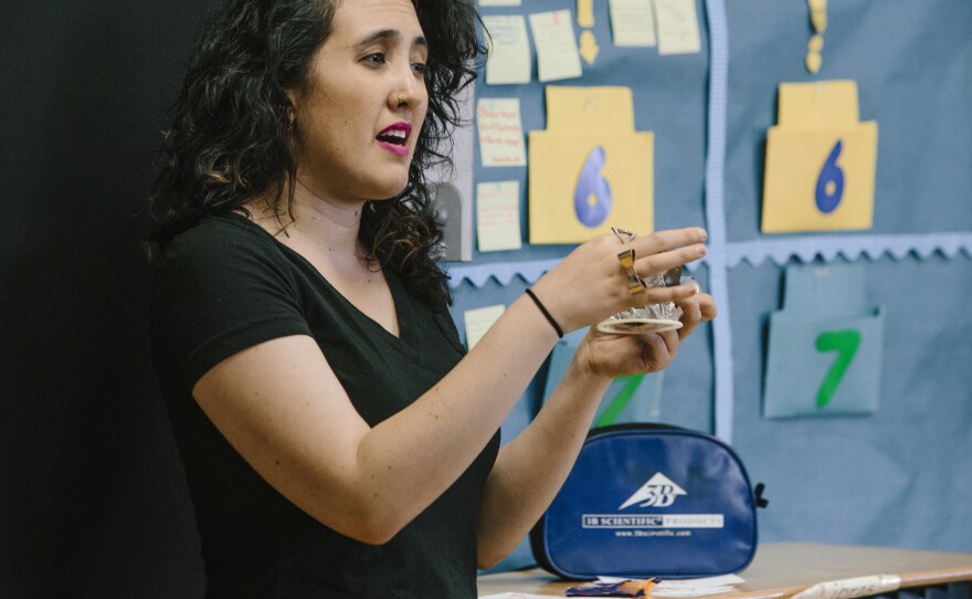Solow demonstrates how to use a female condom.