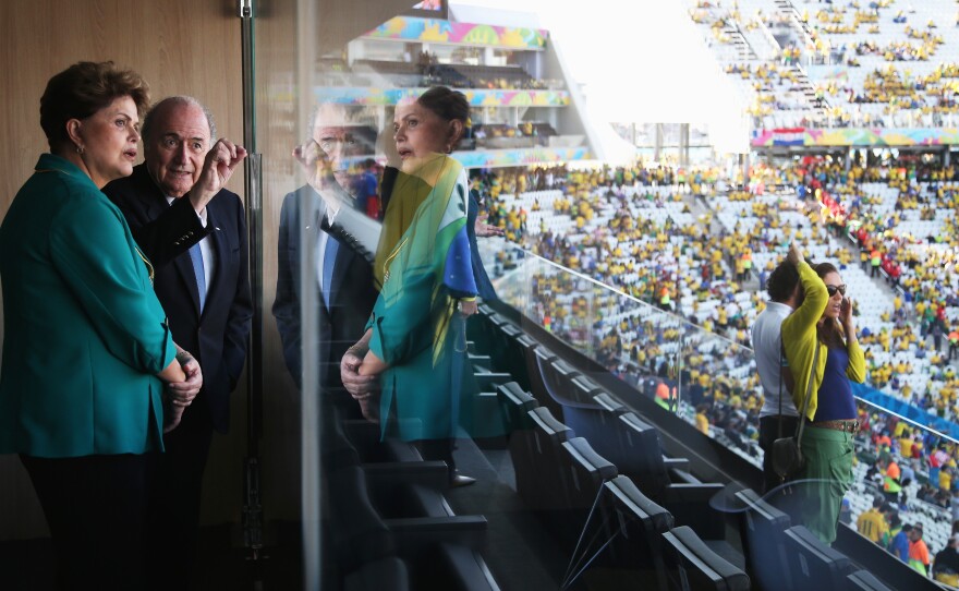 Brazilian President Dilma Rousseff and FIFA President Sepp Blatter talk prior to Thursday's World Cup match between Brazil and Croatia at Arena de Sao Paulo in Sao Paulo, Brazil.