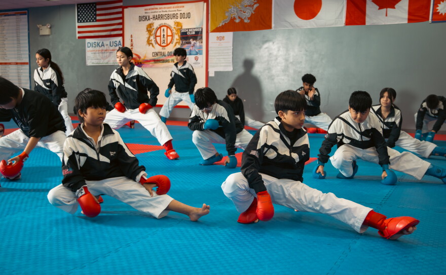 Students of the DISKA Harrisburg Dojo, mainly of Nepali-speaking Bhutanese origin, begin their warmup on April 16, 2025, in Harrisburg, Pa.