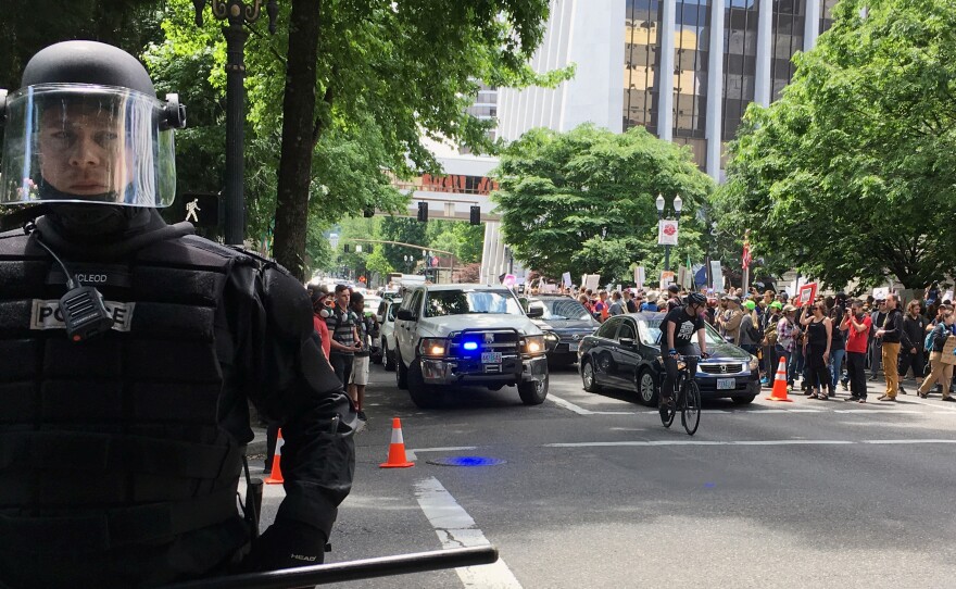 Thousands of protesters gather in Portland, Ore., Sunday, for competing rallies following last month's fatal stabbing of two men on a light-rail train by a man police say was shouting anti-Muslim slurs.