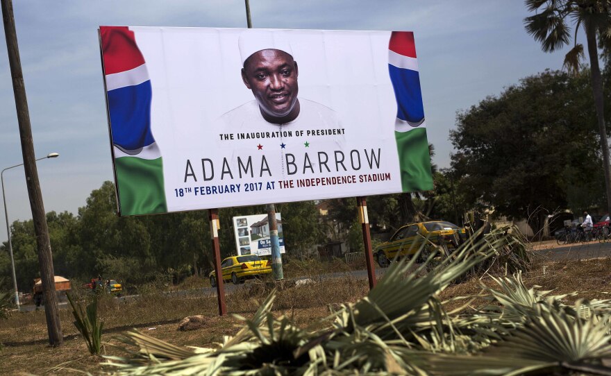 A billboard calling for the inauguration of Adama Barrow as president on the side of a road last month in Serrukunda, Gambia.