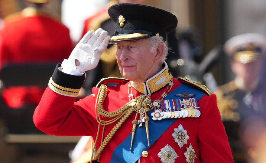 Britain's King Charles III salutes the troops outside Buckingham Palace during Trooping The Colour, the King's annual birthday parade, in London, Saturday, June 13, 2026.