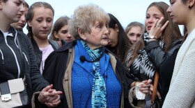 Eva Kor (center) with German girls. "EVA: A-7063" recounts the incredible true story of an Auschwitz survivor's journey to forgiveness and healing. After decades of torment and pain following her liberation, she decided to use her experiences as a teaching tool for other generations.