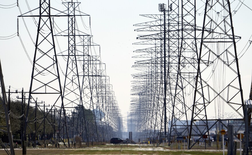 Power lines are seen on Feb. 16 in Houston. The Texas Public Utility Commission has declined to reverse $16 billion in charges from the worst of February's winter storm.