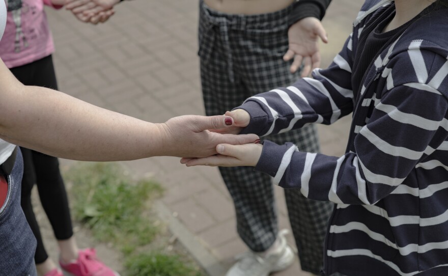 Ukrainian children play on the playground near Poland's Warsaw Ukrainian School.