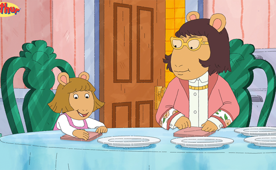 DW and Minnie fold napkins in a scene from "An Arthur Thanksgiving."