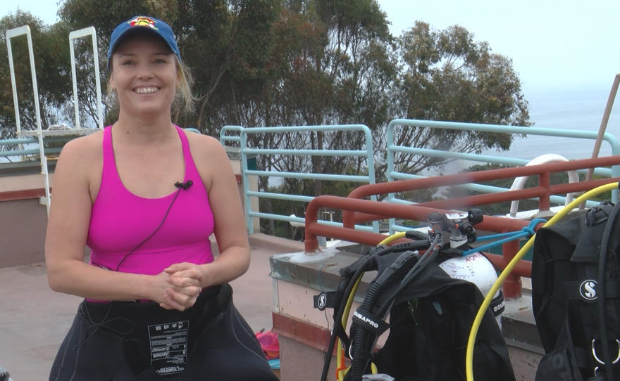 Celeste Parry explains the various components of her SCUBA equipment on Aug. 14, 2025 at Birch Aquarium.