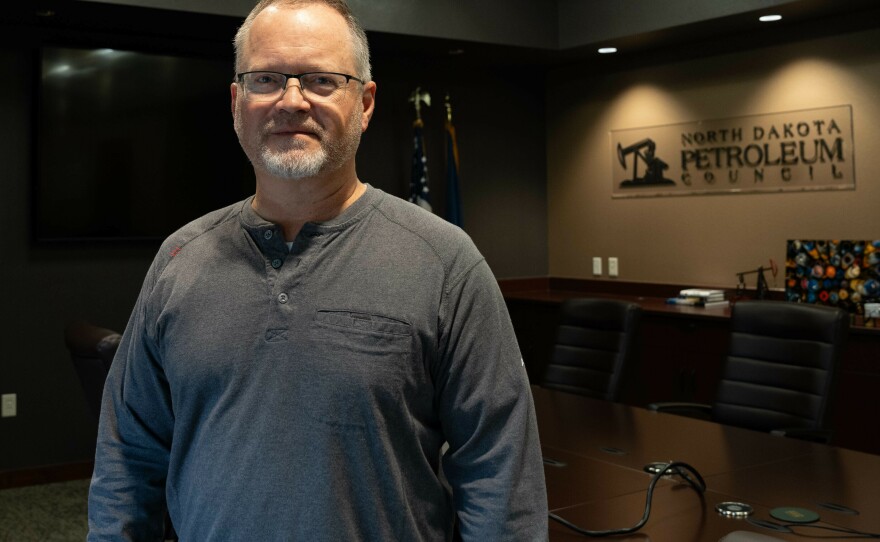 Former Lt. Gov. Brent Sanford, pictured in his office in Bismarck, now works for North Dakota's petroleum industry. He's trying to find workers to fill jobs in the Bakken oil fields in the western part of the state.