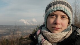 Greta Thunberg beside the Bełchatów coal power station in Poland. The largest single source of carbon dioxide emissions in the European Union.