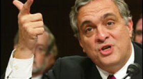 Then-CIA Director George Tenet makes a point as he testifies April 14, 2004, before the 9/11 Commission. He defended the agency's pre-Sept. 11, 2001, efforts on combating terrorism.