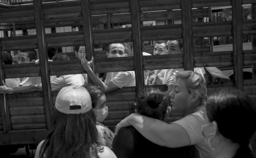 People under arrest say goodbye to their relatives outside San Salvador's Ilopango jail in September 2022.