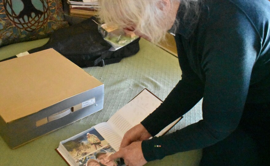 Jennifer Mitchell looks through pictures of travels with her husband, Bill. After Bill was discharged from the Montana State Hospital, Jennifer discovered he was taken off some of his congestive heart failure medications. He later suffered a cardiac arrest and died in hospice care.
