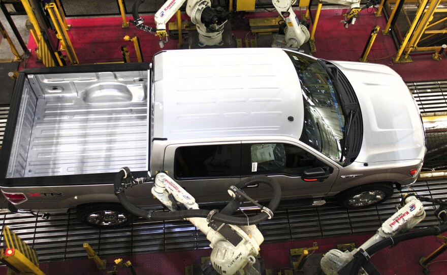 Ford says it sold the most F-series trucks since 2006. Here, a 2014 F-150 goes through quality control on the assembly line at Ford's Dearborn Truck Plant.