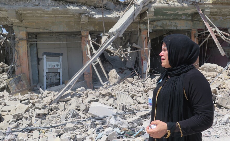 Manal Idrees, a former resident of west Mosul, returns to the Old City on a grim mission to try to find the body of her son. She says he was beheaded by ISIS because his uncles were police officers.