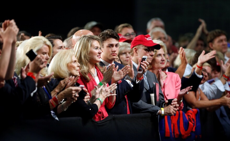 The audience reacts as Republican presidential candidate Donald Trump delivers a campaign speech in Charlotte, N.C., Thursday.