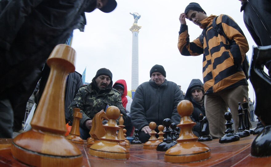 Protesters play chess in Independence Square in Kiev last winter. Some would say that Russian President Putin is playing geopolitical chess when it comes to Ukraine.