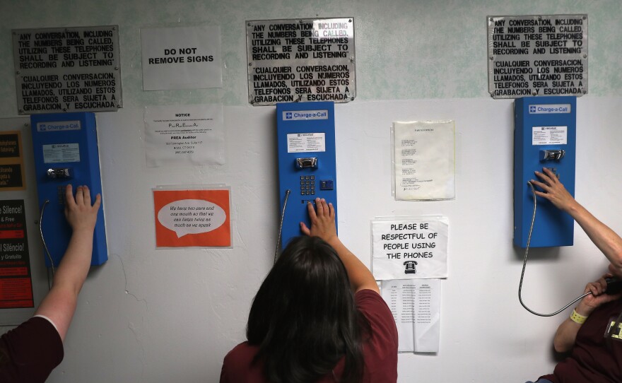 Prison inmates make one of their daily allotment of six phone calls at the York Community Reintegration Center.
