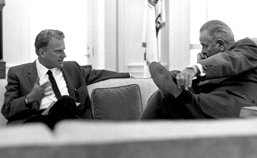 Billy Graham (left) talks with President Lyndon B. Johnson in the Oval Office, 1966.