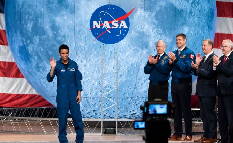 NASA astronaut Jessica Watkins waves at the audience during the astronaut graduation ceremony at Johnson Space Center in Houston, Texas, in January 2020. In April 2022, she will become the first Black woman to live and work on the International Space Station.