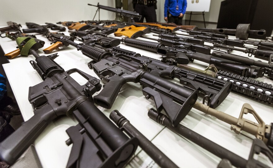 FILE - In this Dec. 27, 2012, file photo, a variety of military-style semi-automatic rifles obtained during a buy back program are displayed at Los Angeles police headquarters. The 9th U.S. Circuit Court of Appeals overturned two lower court judges and upheld California’s ban on high-capacity magazines Tuesday, Nov. 30, 2021, in a split decision that may be headed for the U.S. Supreme Court.