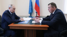 Russian President Vladimir Putin, left, listens to Sakhalin Region Governor Valery Limarenko in Kurilsk on the Iturup Island, the largest of the Kuril Islands of Russia's fareast, on Thursday, Aug. 13, 2026.