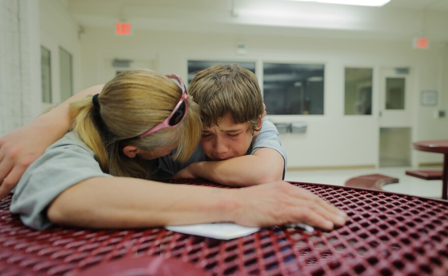 Vinny, at age 13, cries during a visit with his mother, Eve, at the Bernalillo County Juvenile Detention Center in Albuquerque, New Mexico. "Mom, just get me out," he says. Vinny was incarcerated for stabbing his mother's assailant: "When my mom was being beat up, I was so scared. I wanted to defend my mom."