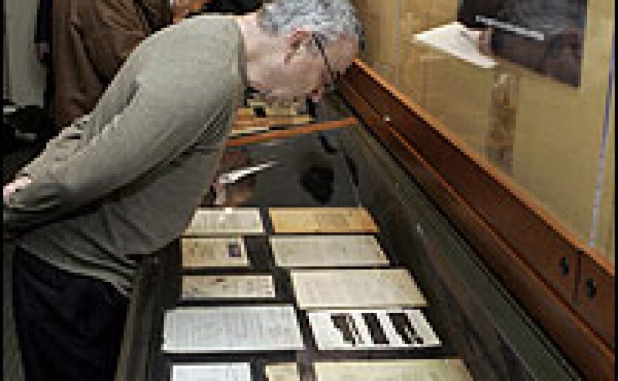 Journalists view a display of documents discovered in the YIVO Institute for Jewish Research archives by a volunteer last year.