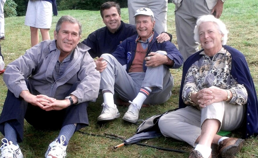 Texas governor and presidential candidate George W. Bush, Florida governor Jeb Bush, former president George H.W. Bush and his wife Barbara at the Ryder Cup golf competition in 1999.