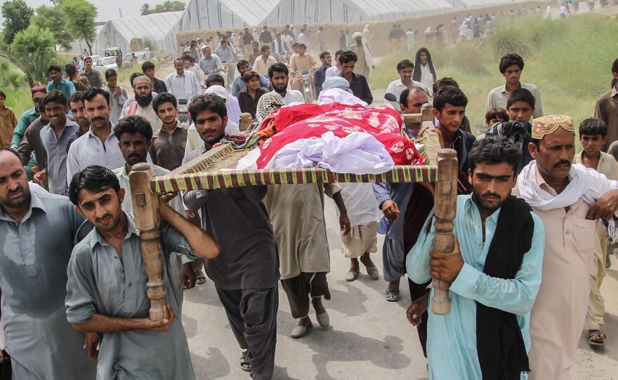 Friends and family carry Pakistani social media celebrity Qandeel Baloch's body at her funeral.