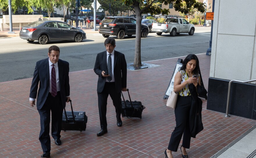 Robert D. Eassa, at left, the lead attorney for UC San Diego, arrives at the Hall of Justice in San Diego, June 21, 2023.