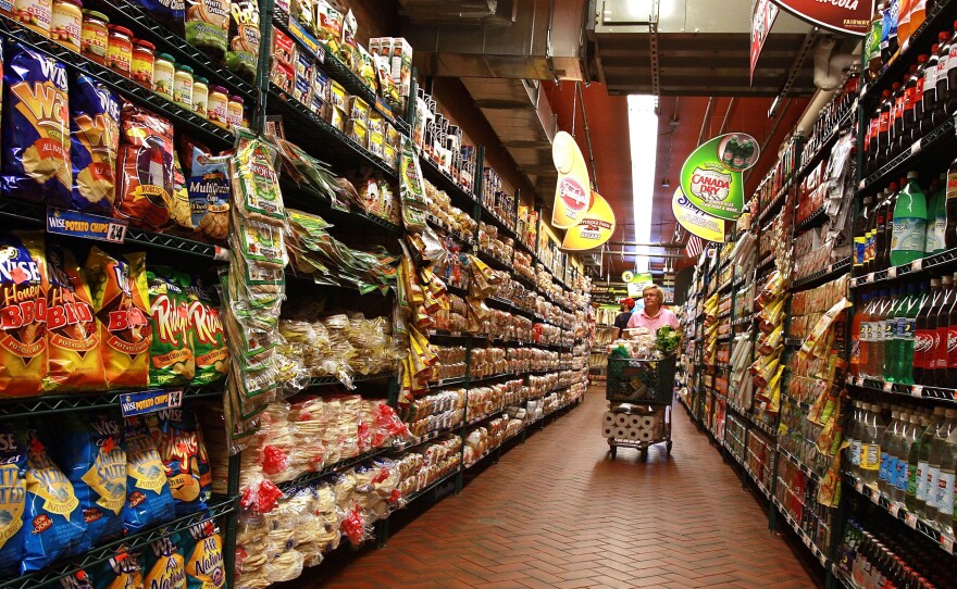 A woman shops at a supermarket in New York City.