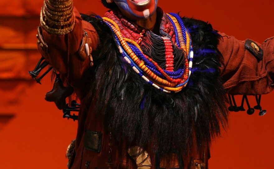 Tshidi Manye performs as Rafiki.