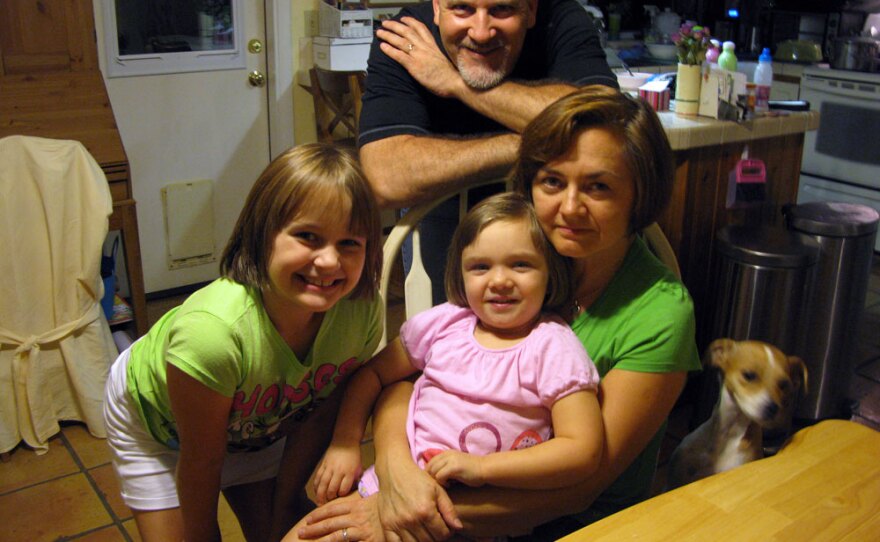 The Donnell family once earned twice as much as they do now per year, but they cut back -- by choice -- to focus on what mattered most to them. Clockwise are Gregg, Lola, Kelly and Isabel.