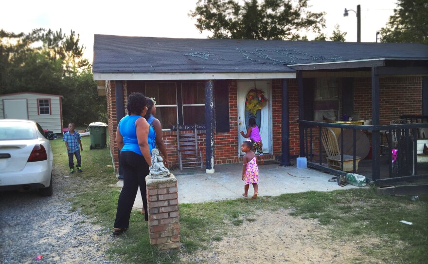 Ethel Johnson and her daughter Clanlethia go into the Camden, Alabama home of one of the teens Ethel recruited for the study.