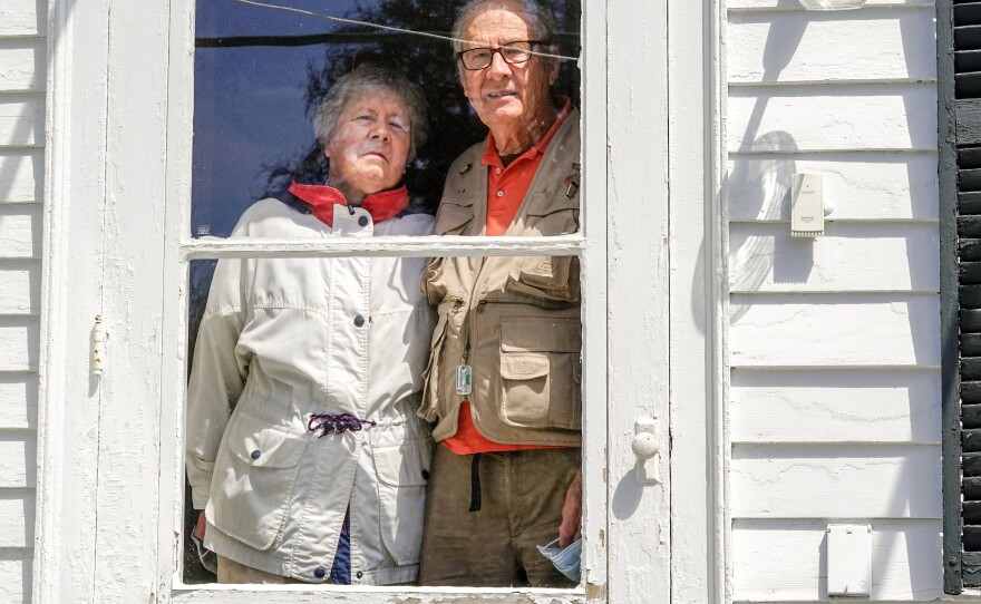 Don Munro says he and his wife, Betty, sometimes have to catch themselves from going in for a handshake or a hug if they run into friends at the nearby general store.