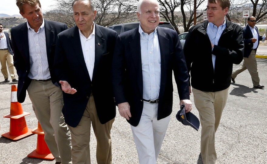 From left, Sen. Jeff Flake, R-Ariz., Sen. Chuck Schumer, D-NY, Sen. John McCain, R-Ariz., and Sen. Michael Bennett, D-Colo, arrive at a news conference after their tour of the Mexico border with the United States on Wednesday in Nogales, Ariz. The senators are part of the "Gang of Eight," a larger group of legislators collaborating for an immigration reform package.