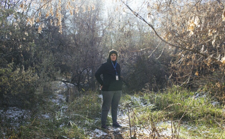 Volunteers of America outreach employee Sanela Piragic poses for a portrait near a homeless encampment in South Salt Lake.