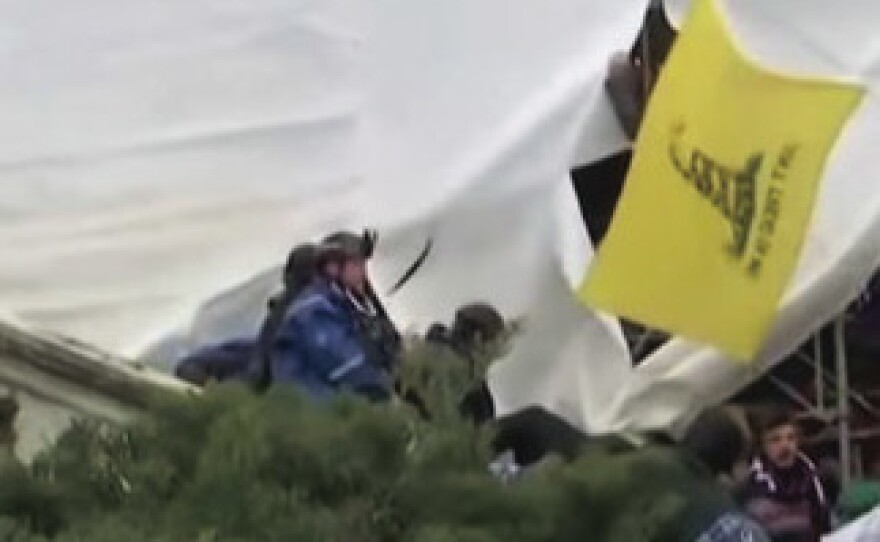 The U.S. government says in its affidavit that this photo shows Reffitt outside the Capitol on Jan. 6, 2021, wearing a blue jacket over a tactical vest and a helmet with a camera.