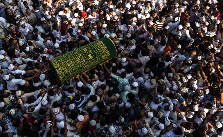 Mourners carry the coffin of Ko Ni, a prominent Muslim lawyer who was shot dead in 2017. Ko Ni's killer was sentenced to death on Friday.