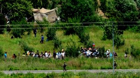 Syrian refugees waited to cross the border into Turkey near the Turkish city of Hatay on Wednesday. Turkish authorities confirmed that 120 Syrians had crossed the border late Tuesday.