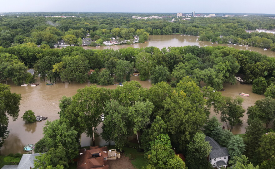 This aerial photo provided by the Indianapolis Fire Department shows flooding in northern Indianapolis, Ind., Saturday, Aug. 15, 2026.