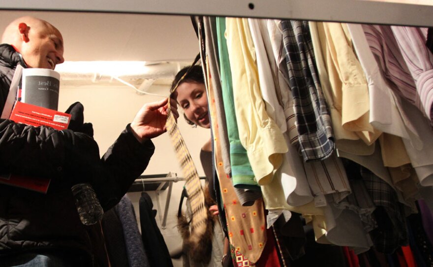Lisa Tumbarello, a stylist trained by Stacy London from TLC's <em>What Not to Wear</em>, encourages customer Tom Spinelli to buy some ties at a Goodwill trunk show at Caramel, a boutique in Washington, D.C.