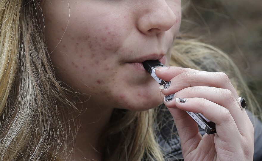 An unidentified 15-year-old student at a high school in Cambridge, Mass., vaped near campus in April.