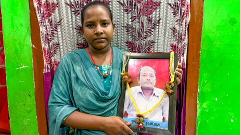 Jyoti Kumari holds a photo of her dad, Mohan Paswan. She became a global celebrity after news spread of her 700-mile bicycle ride, carrying her injured father on her bicycle, to get him to their village. Promises were made to reward her heroic feat. Were they kept?