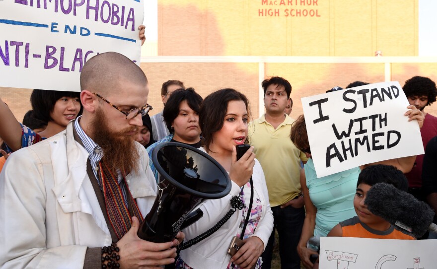 Aisha U-kiu, president of American Muslim Professionals of Dallas and a graduate of MacArthur High School, speaks at a prayer vigil in support of Ahmed Mohamed in September 2015, in Irving, Texas. Ahmed, 14, was arrested at MacArthur High School when a clock he built and brought to school was mistaken for a bomb by teachers and police.