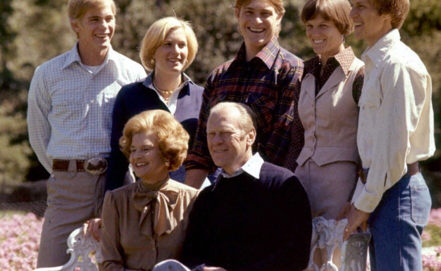 Members of the Ford family pose on the White House grounds in this undated photo. From left, standing: Son Steve; daughter Susan; son Jack; son Michael's wife, Gayle; and Michael. Seated in front: President Gerald and first lady Betty Ford.